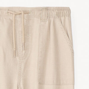 Pantalón de tela con puños para bebé niño. 
