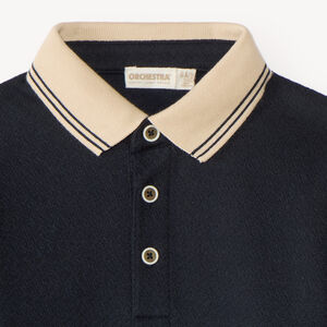 Polo de manga larga para niño con cuello contrastante y original. 