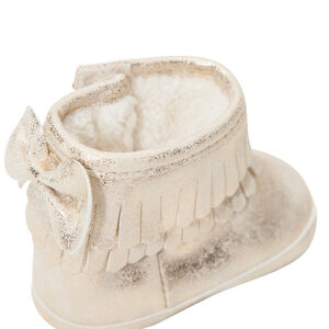 Botines dorados con flecos y lazo con forro y pelo falso 