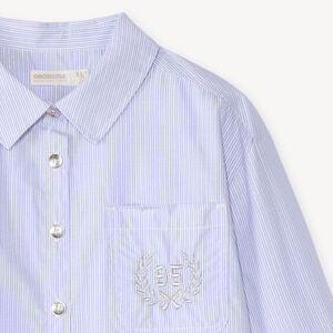 Camisa de niña de manga larga a rayas con detalles plateados. 