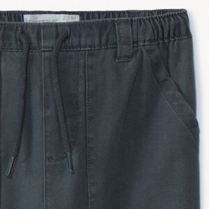 Pantalón liso con dos bolsillos plaqué para bebé niño 