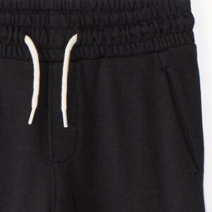 Pantalón de chándal liso con bolsillo cargo niño 