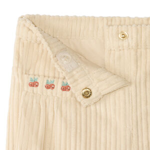 Pantalones de pana para bebé niña con estampado de frutas. 
