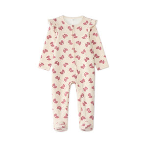 Pijamas de bebé niña con cremallera forrados en sherpa con motivo de lazos. 