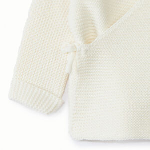 Brassière en tricot point mousse uni pour bébé fille se traduce como:

Chaqueta tipo pelele de punto bobo liso para bebé niña 