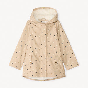Parka de goma con estampado de lunares y forro para niña. 