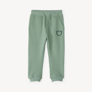 Pantalón de chándal para bebé niño con tejido de panal y estampado de oso. 