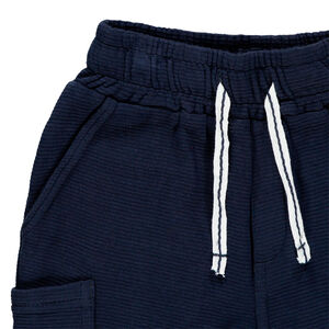 Bermudas de felpa con bolsillos tipo plastrón para niño 