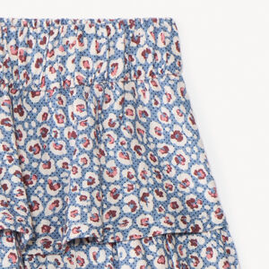 Falda corta con volantes y estampado fantasía niña 