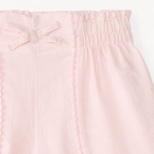 Short de tela con galón de pompones para niña 