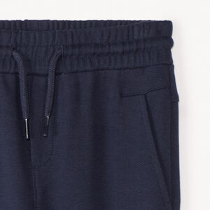 Jogging de piqué liso con motivo en relieve niño 