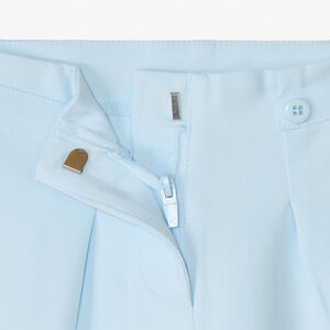 Pantalón amplio con pinzas y flor bordada niña 