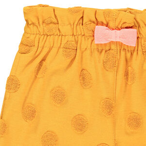 Short jaune à pois en relier et noeud rose 
