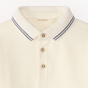 Polo de manga larga para niño con cuello contrastante y original. 