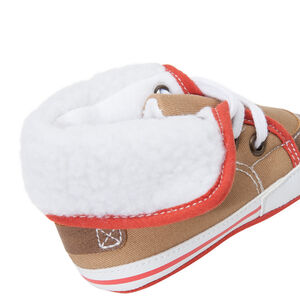 Zapatillas flexibles con cordones y pelo falso 