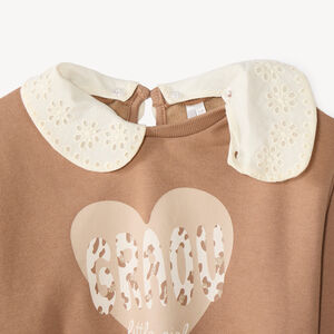 Sudadera niña oversized con cuello Peter Pan desmontable y estampado divertido. 