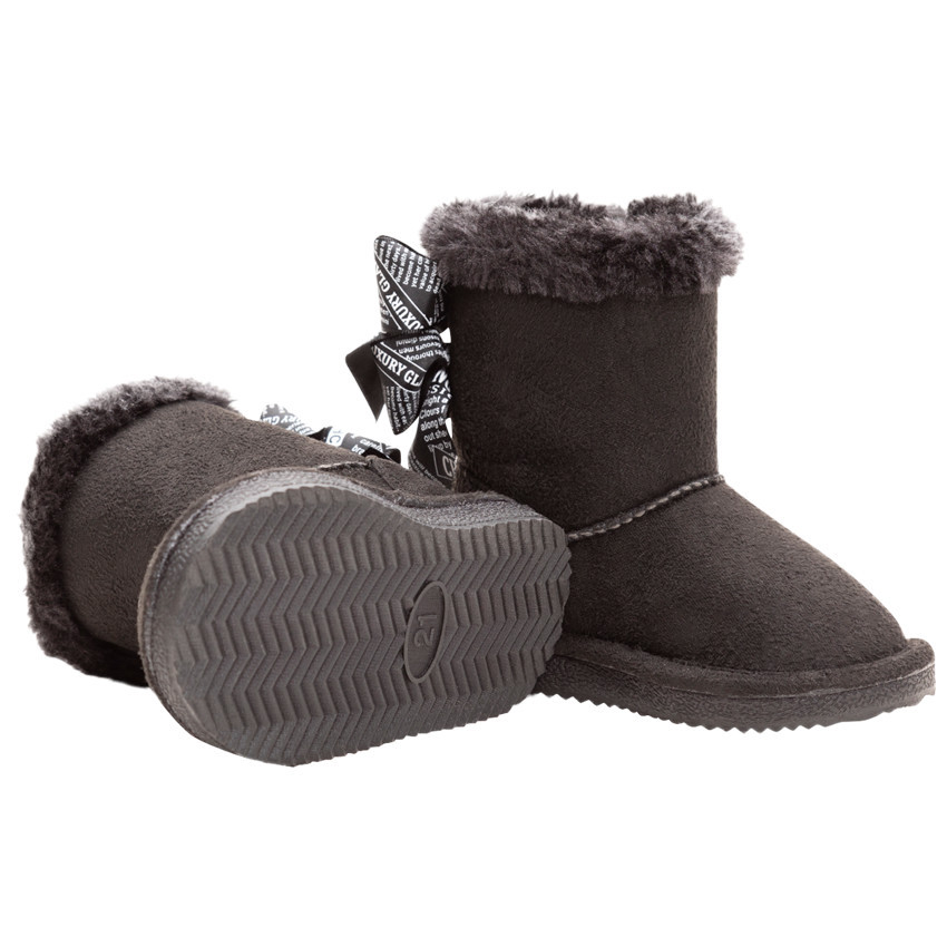 Botines forrados con lazo en la parte posterior para niña. 