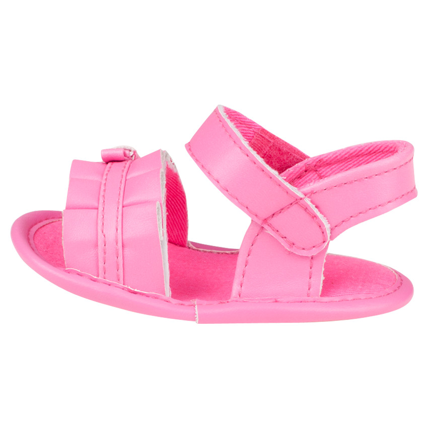 Zapatos descubiertos plisados de color rosa fluo con lazos 