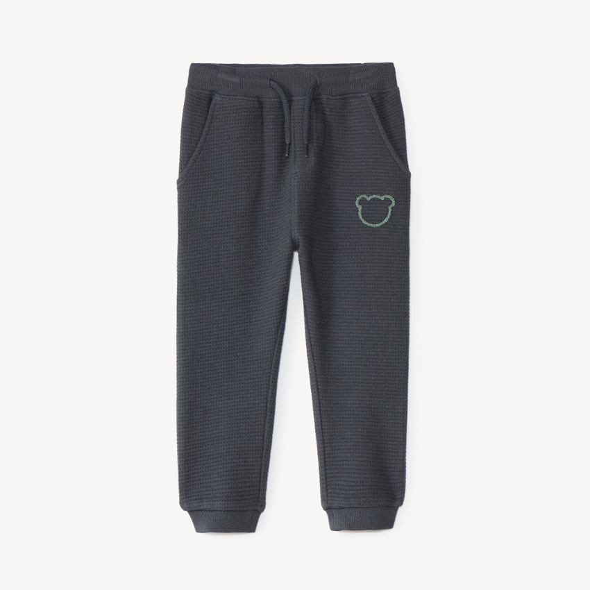 Pantalón de chándal para bebé niño con tejido de panal y estampado de oso. 