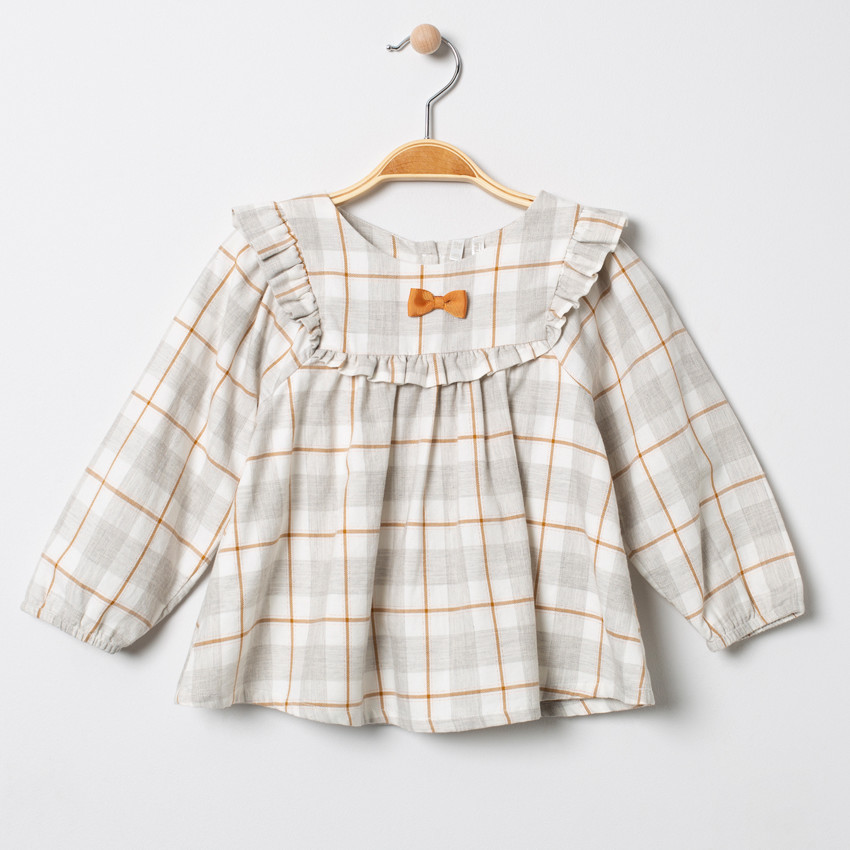 Túnica de cuadros con nudos volantes  