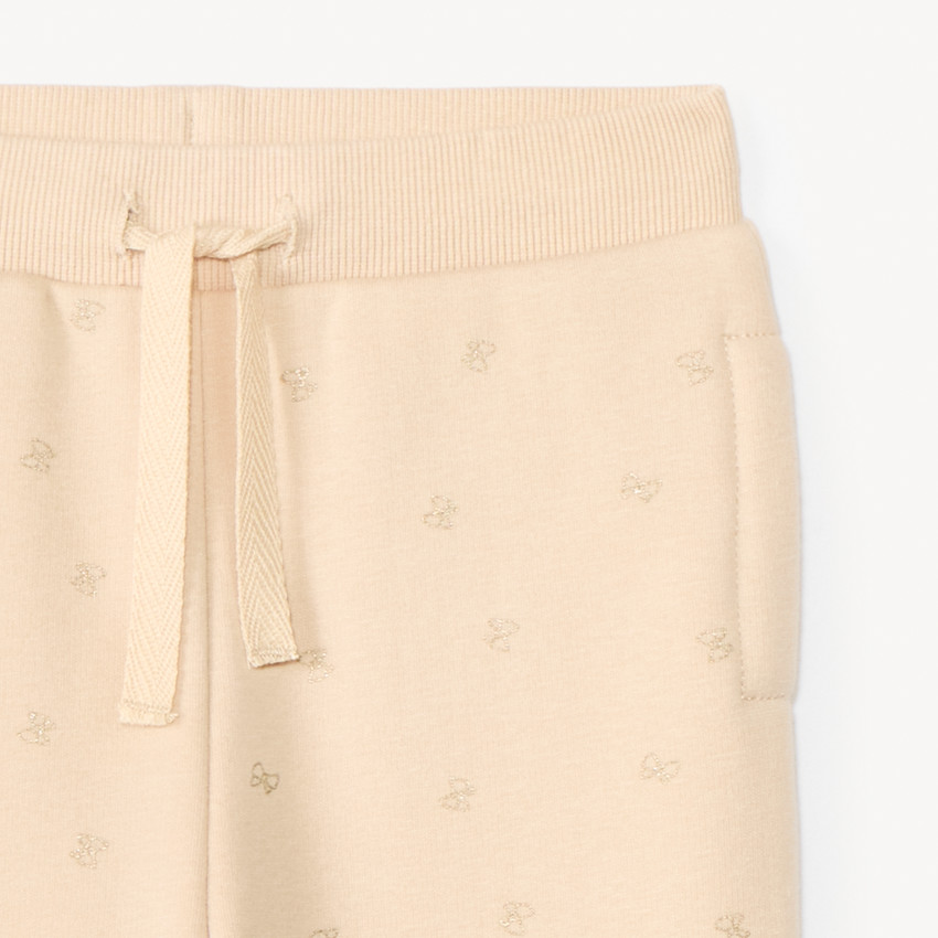 Pantalón jogging de molleton con estampado de lazos con purpurina para bebé niña 