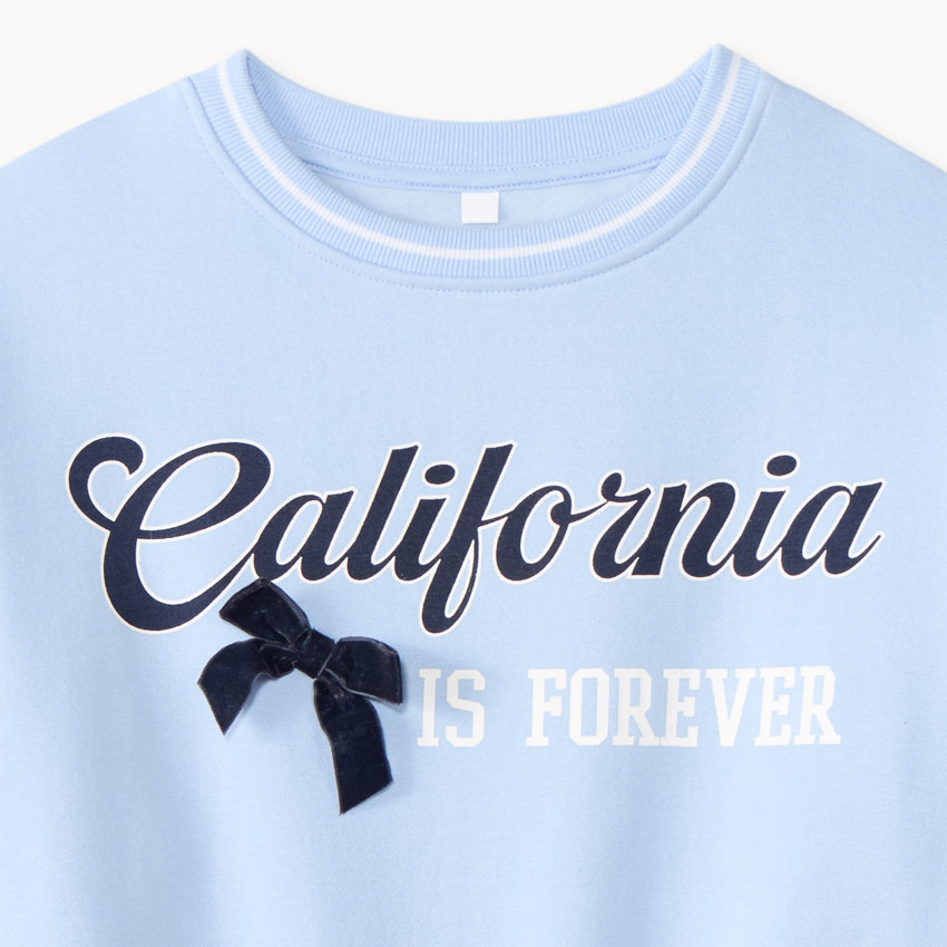 Sudadera niña con estampado de California y base elástica. 
