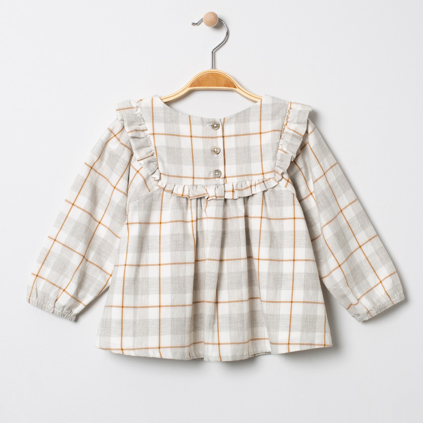 Túnica de cuadros con nudos volantes  