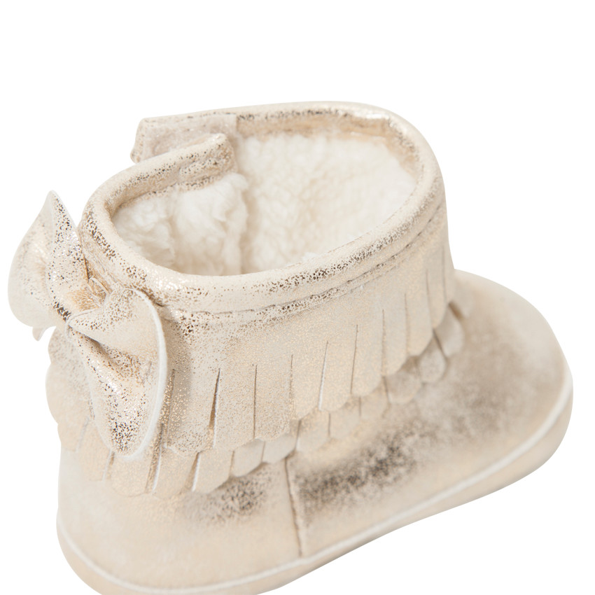 Botines dorados con flecos y lazo con forro y pelo falso 