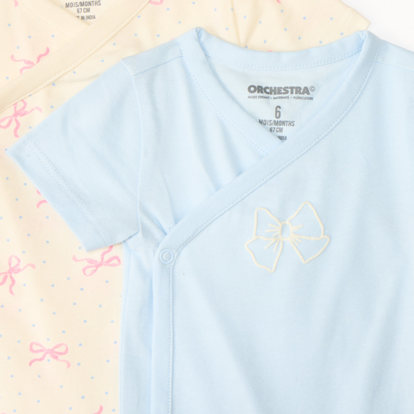 Conjunto de 7 bodies de manga corta con diseño de lazo para niña, apertura diferente según la edad. 