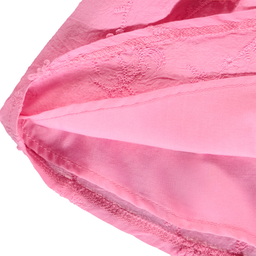 Falda corta de gasa rosa y bordado inglés para niña bebé 