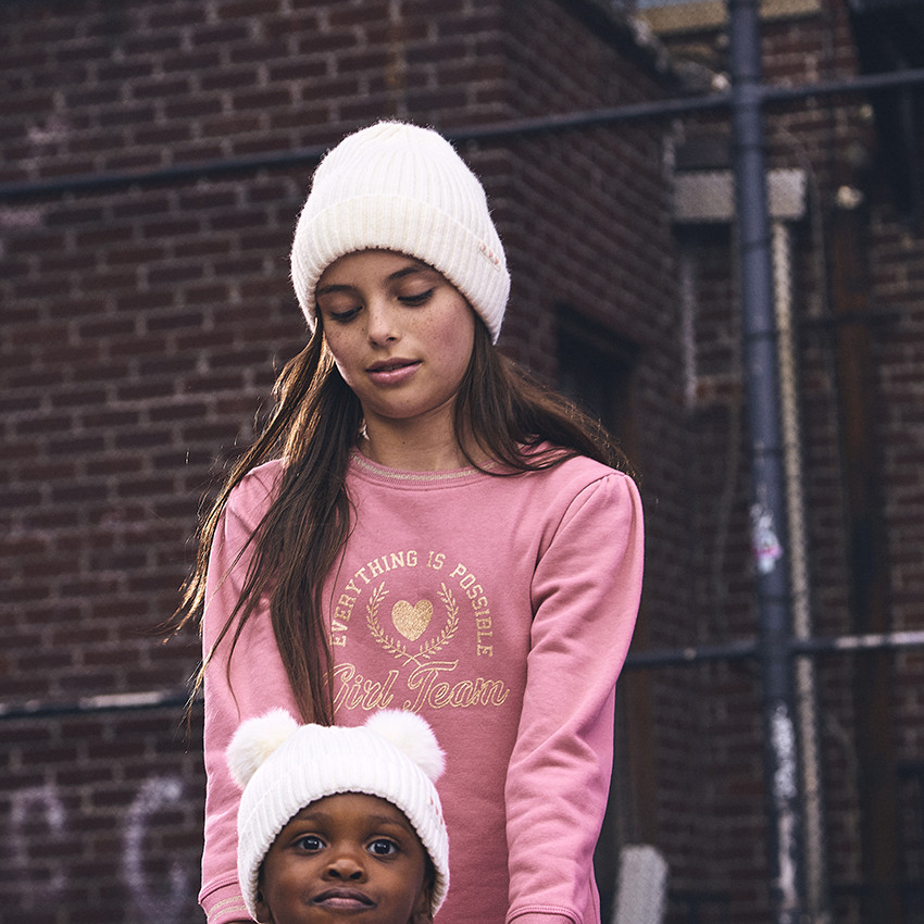 Bonnet en tricot avec pompons pour bebe fille Orchestra