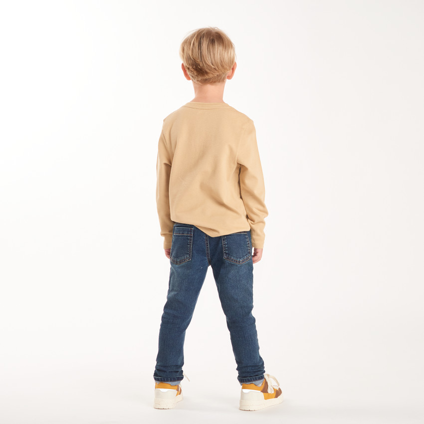 Vaqueros slim en denim con costuras en contraste niño 