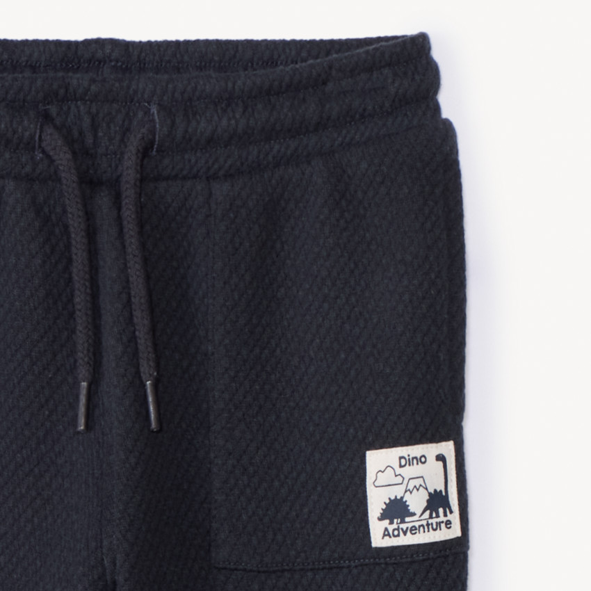 Jogging de color sólido con etiqueta para bebé niño 