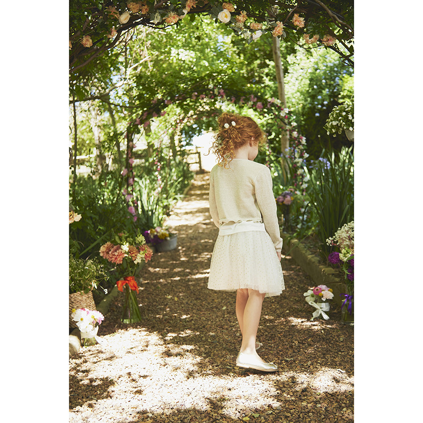 Gilet corto de punto con base festoneada para niña 