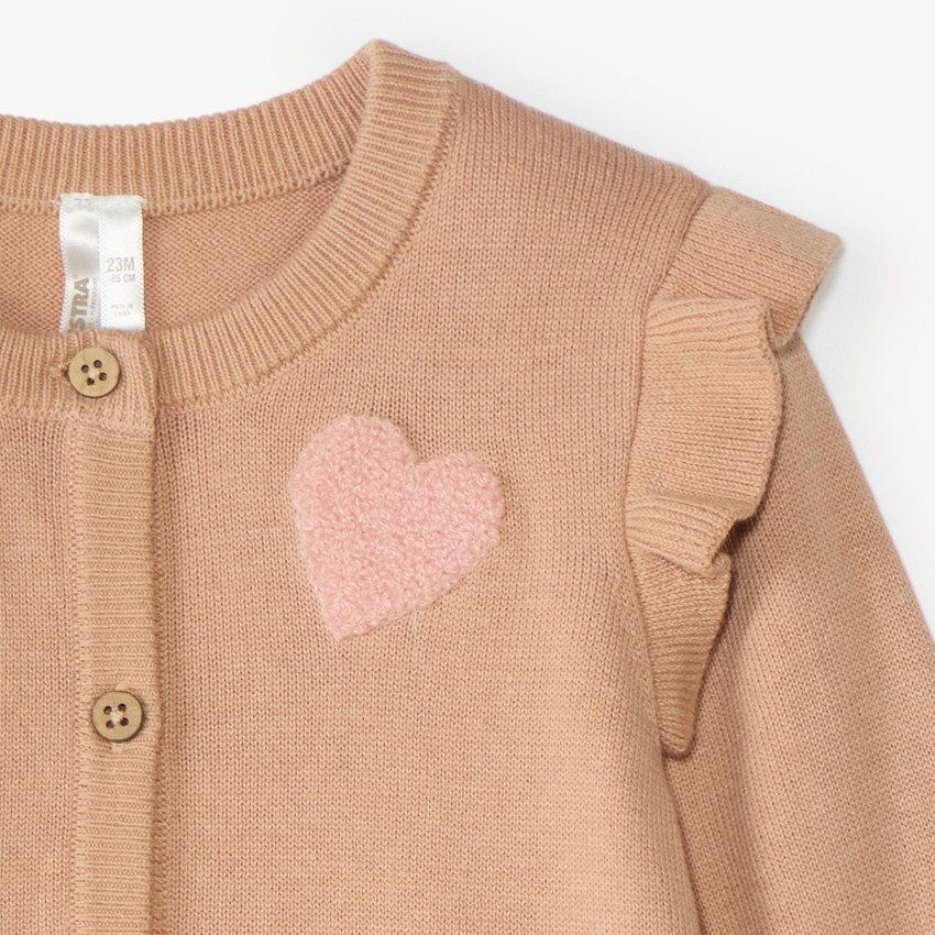 Chaleco de bebé niña de punto con diseño fantasía y parche de bucle. 