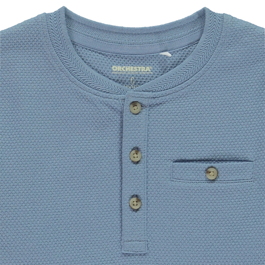 Camiseta de manga larga unicolor con cuello tunecino y bolsillo para niño 