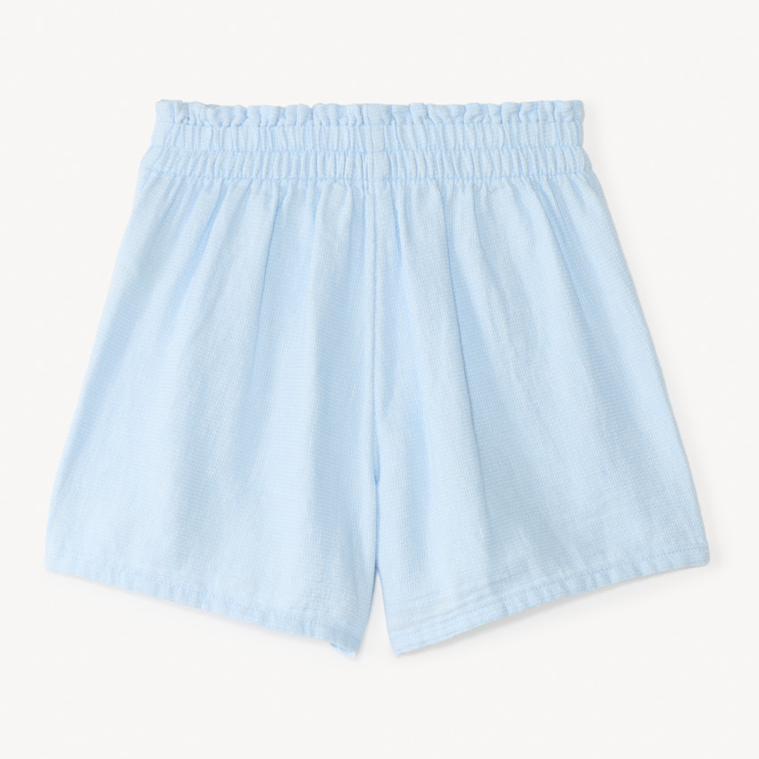 Short de tela con galón de pompones para niña 