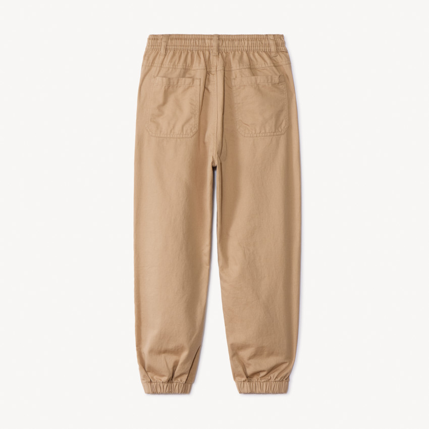 Pantalón liso de tela con cintura elástica niño 
