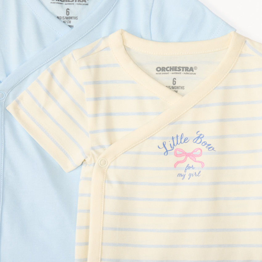 Conjunto de 7 bodies de manga corta con diseño de lazo para niña, apertura diferente según la edad. 