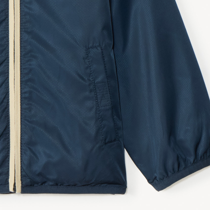 Cortavientos liso forrado en jersey para niño. 