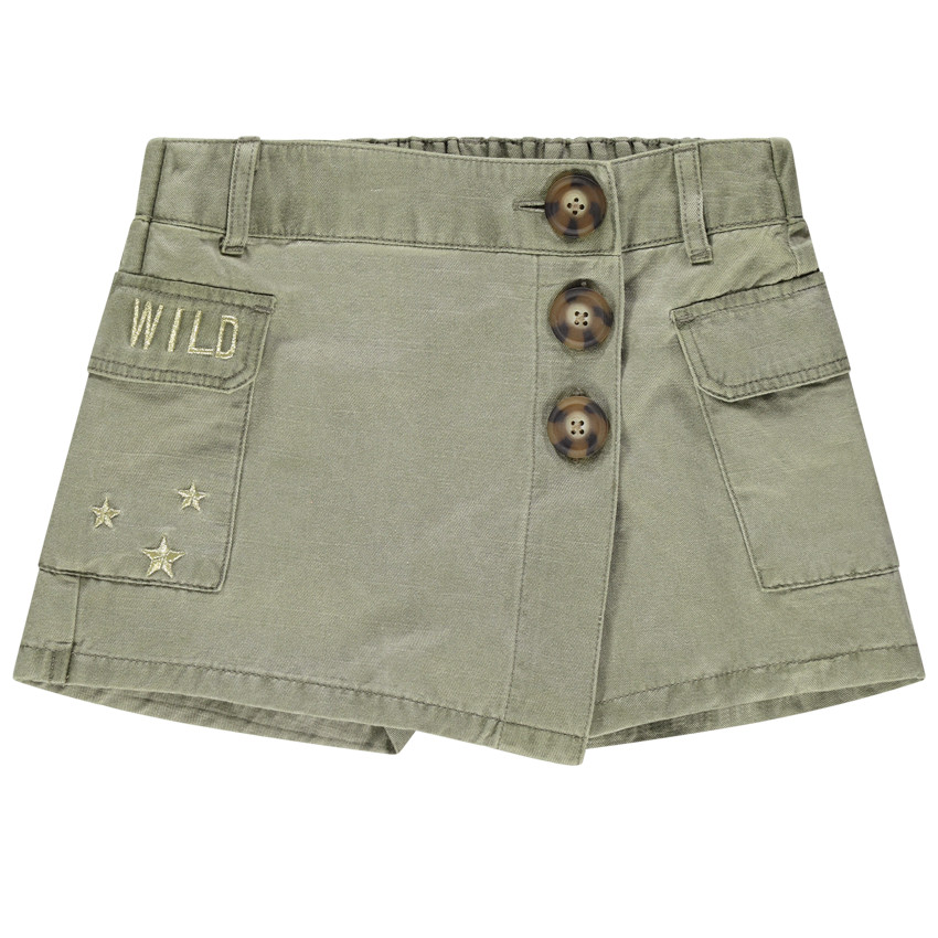Jupe short en toile à poches et broderies dorées 
