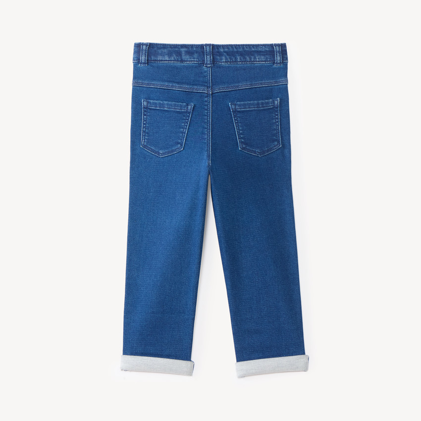 Pantalón vaquero para bebé niño liso con dobladillos. 