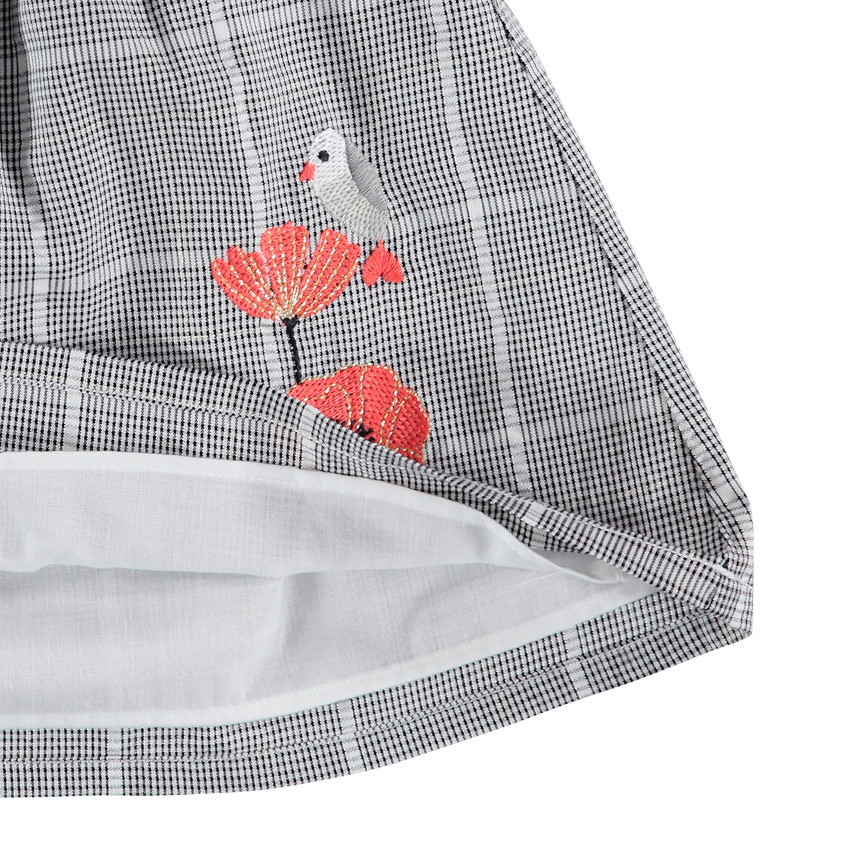 Tunique manches longues à carreaux et fleur brodée 