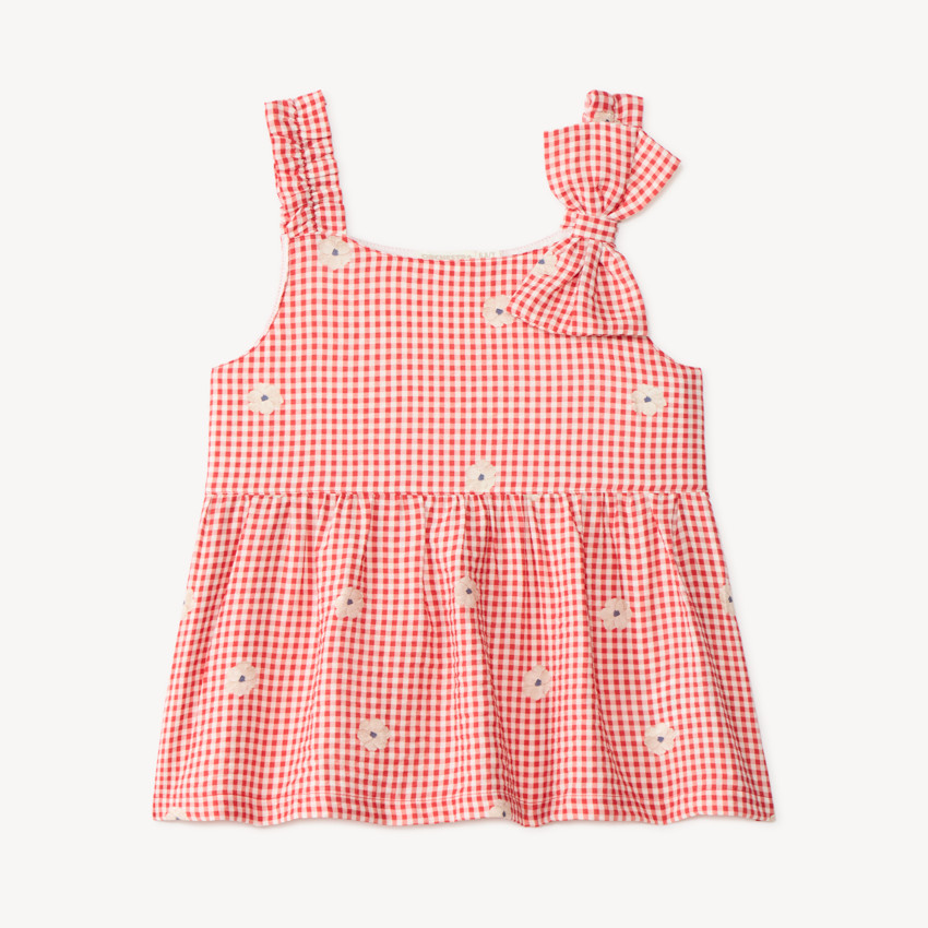 Top de niña vichy con lazo en el hombro y bordado floral. 