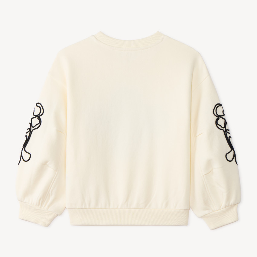 Sudadera de niña de felpa con flores de cording. 