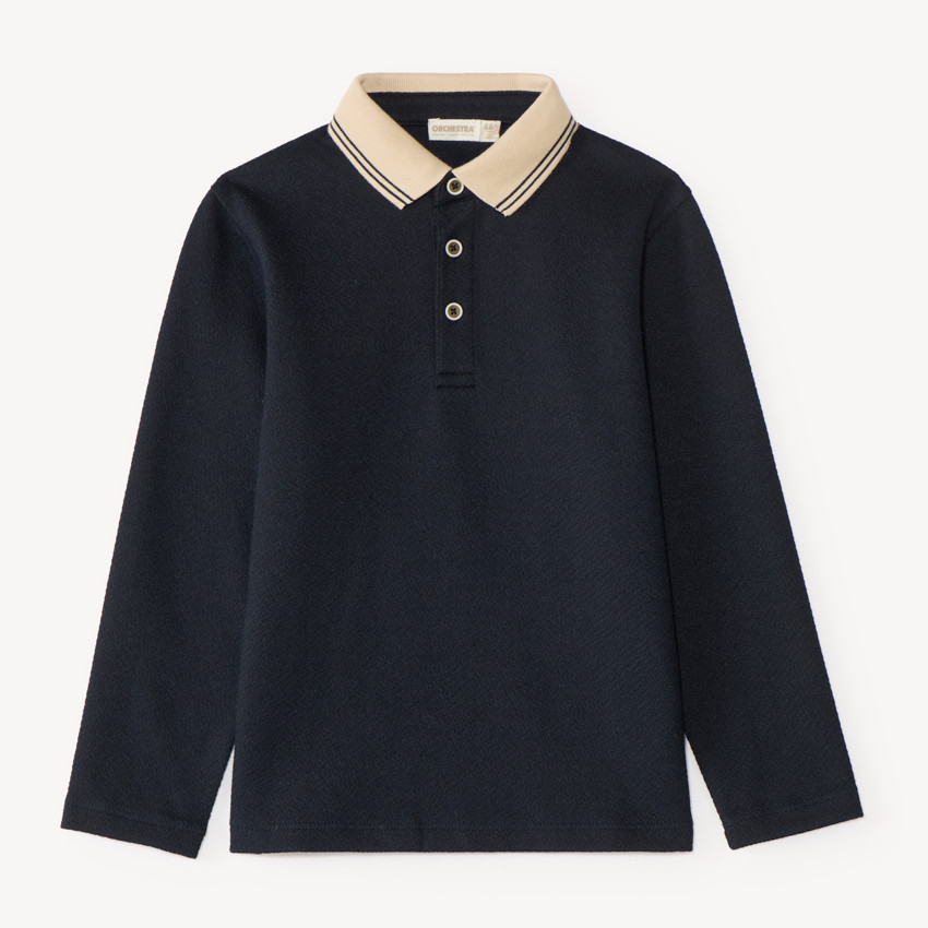 Polo de manga larga para niño con cuello contrastante y original. 