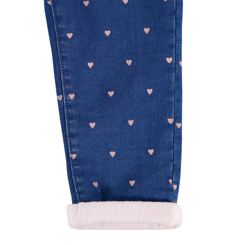 Vaqueros con efecto desgastado all over y forro de borreguillo 