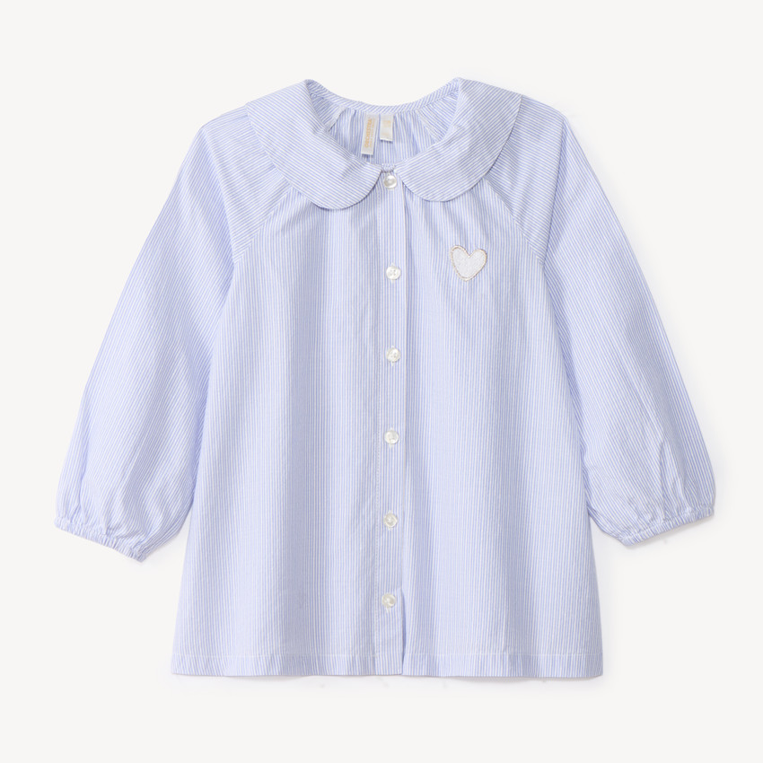 Camisa de niña bebé de manga larga abullonada y a rayas. 