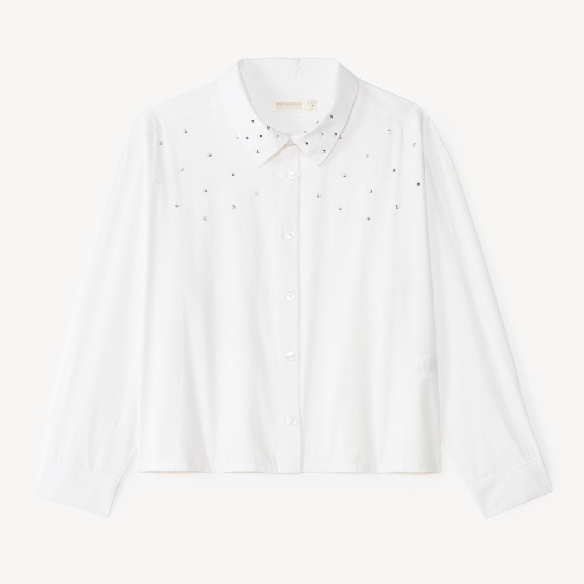 Camisa blanca de manga larga para niña con detalles de strass. 
