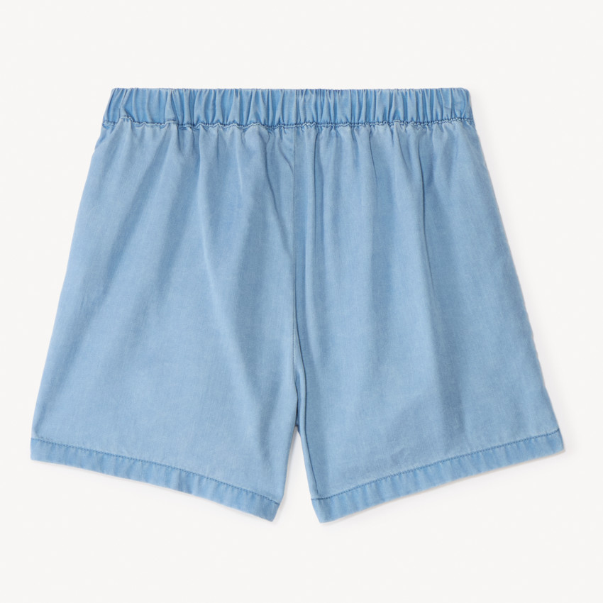 Falda corta lisa en Tencel con volantes para niña. 